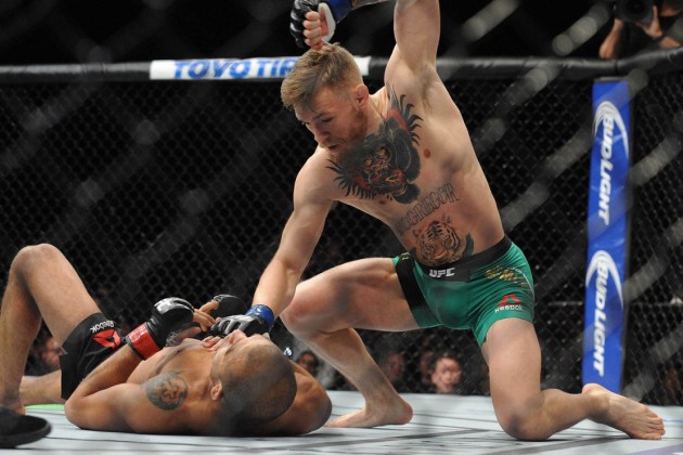 December 12, 2015; Las Vegas, NV, USA; Conor McGregor lands punches to win b technical knockout  against Jose Aldo during UFC 194 at MGM Grand Garden Arena. Mandatory Credit: Gary A. Vasquez-USA TODAY Sports ORG XMIT: USATSI-257072 ORIG FILE ID:  20151212_gav_sv5_146.jpg