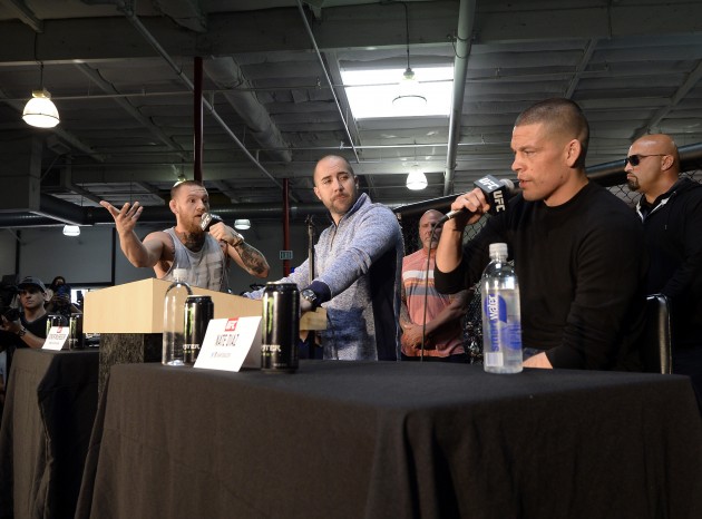 TORRANCE, CA - FEBRUARY 24: UFC featherweight champion Conor McGregor (L) and lightweight contender Nate Diaz (R) participate in a news conference with moderator Dave Sholler (C), UFC vice president of public relations, at UFC Gym February 24, 2016, in Torrance, California. (Photo by Kevork Djansezian/Getty Images)