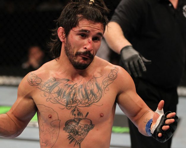 SUNRISE, FL - JUNE 08:   Ian McCall reacts after delivering an accidental low blow against Demetrious Johnson in a Flyweight bout during the UFC on FX 3 event at Bank Atlantic Center on June 8, 2012 in Sunrise, Florida.  (Photo by Josh Hedges/Zuffa LLC/Zuffa LLC via Getty Images)