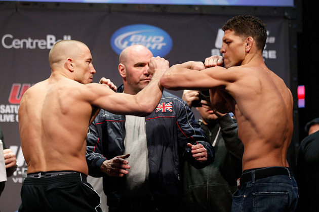 MONTREAL, QC - MARCH 15: Georges St-Pierre (L) and Nick Diaz (R) face off during the UFC 158 weigh-in at Bell Centre on March 15, 2013 in Montreal, Quebec, Canada. (Photo by Josh Hedges/Zuffa LLC/Zuffa LLC via Getty Images)