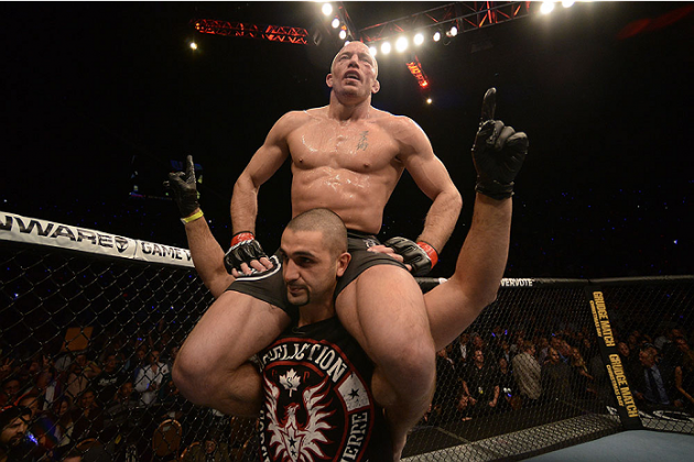 LAS VEGAS, NV - NOVEMBER 16: Georges St-Pierre (top) reacts to his victory over Johny Hendricks in their UFC welterweight championship bout during the UFC 167 event inside the MGM Grand Garden Arena on November 16, 2013 in Las Vegas, Nevada. (Photo by Donald Miralle/Zuffa LLC/Zuffa LLC via Getty Images) *** Local Caption *** Georges St-Pierre