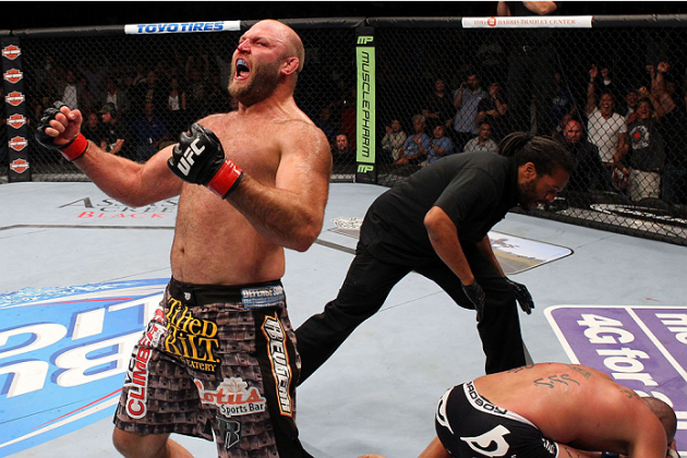 MILWAUKEE, WI - AUGUST 31: (L-R) Ben Rothwell celebrates after defeating Brandon Vera in their UFC heavyweight bout at BMO Harris Bradley Center on August 31, 2013 in Milwaukee, Wisconsin. (Photo by Ed Mulholland/Zuffa LLC/Zuffa LLC via Getty Images) *** Local Caption *** Ben Rothwell; Brandon Vera; Herb Dean