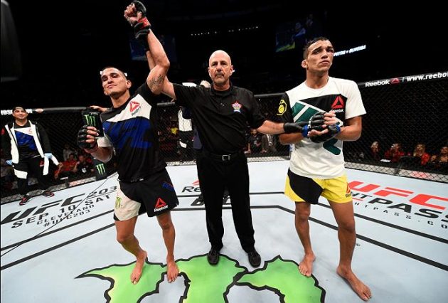 VANCOUVER, BC - AUGUST 27: (L-R) Anthony Pettis of the United States celebrates his submission victory over Charles Oliveira of Brazil in their featherweight bout during the UFC Fight Night event at Rogers Arena on August 27, 2016 in Vancouver, British Columbia, Canada. (Photo by Jeff Bottari/Zuffa LLC/Zuffa LLC via Getty Images)